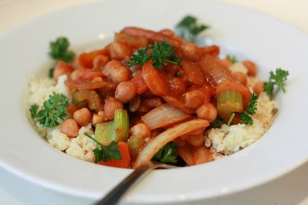 Chickpea and vegetable stew served over couscous