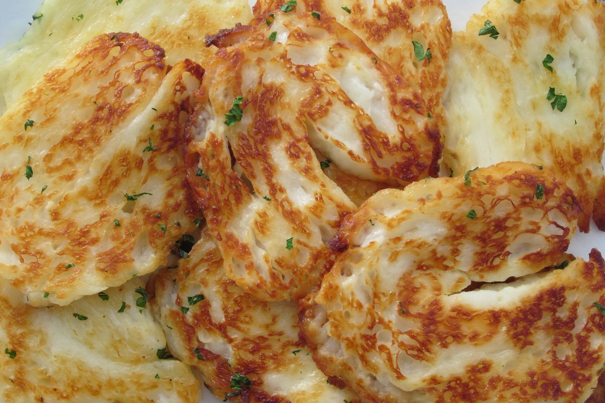 Golden grilled halloumi slices on a plate