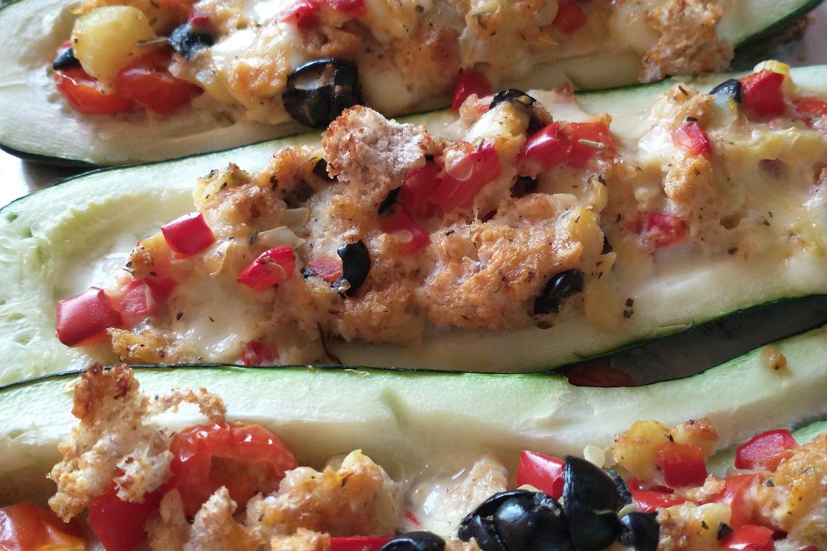 Zucchini halves stuffed with a colorful vegetable filling